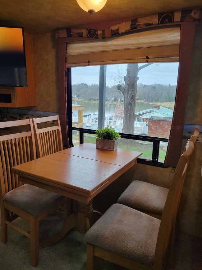 Dining room table and chairs with storage. - 106 Mountain Shore Dr