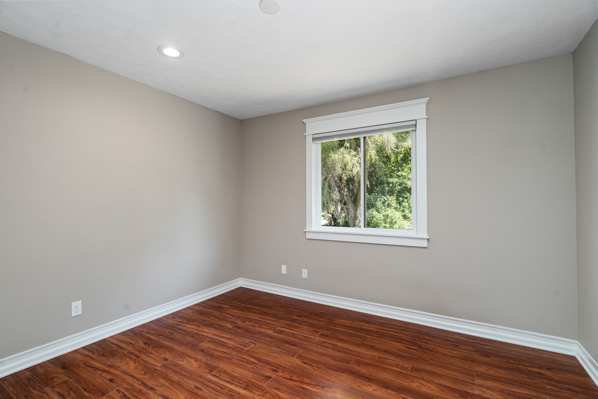 Bedroom 1 overlooking private backyard - 223 E Division St