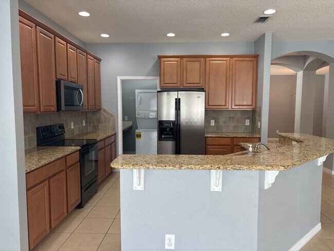 Building Photo - Beautiful 4-Bedroom Home in the Gated Water’s Edge Community/Lake Nona