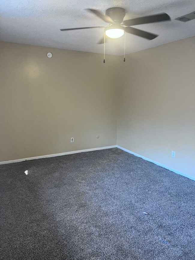 Building Photo - Introducing a 2-bedroom, 1.5-bathroom condo that offers the perfect blend of comfort and convenie...