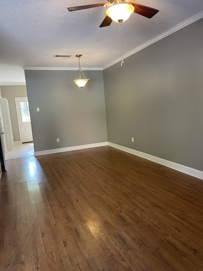 Large, open living/dining area with ceiling fans and pendant lighting - 385 Old Epps Bridge Rd