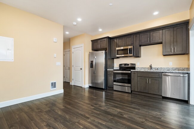 Building Photo - Refined Studio Living at Marigold Apartments — Available Now