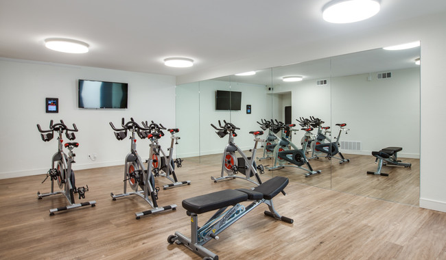 Fitness center also features a spin room - Villas of Pasadena