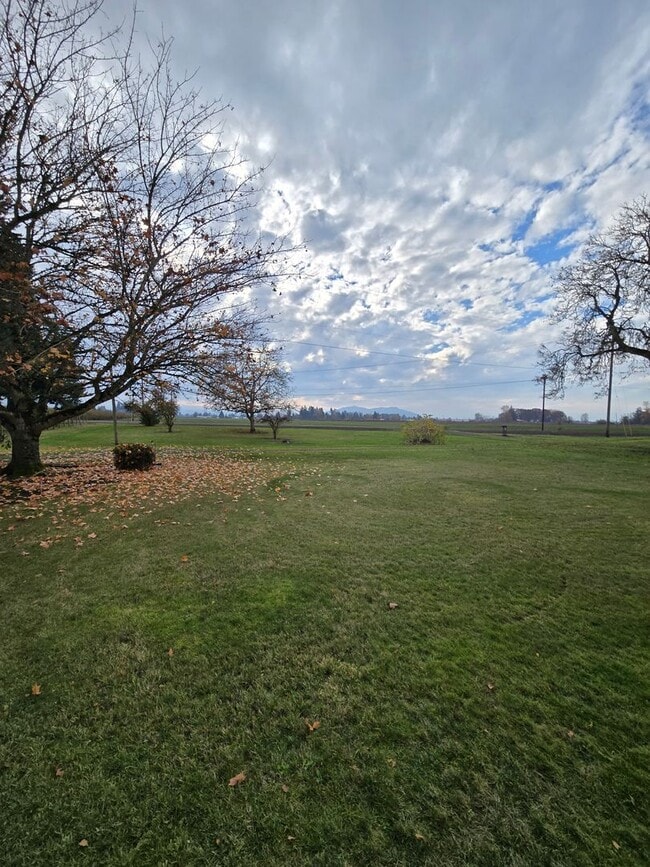 Building Photo - Pet Friendly 3 Bed / 2Bath Home with 2 Garages, Open Air Covered Storage, Large Open Yard, and more!