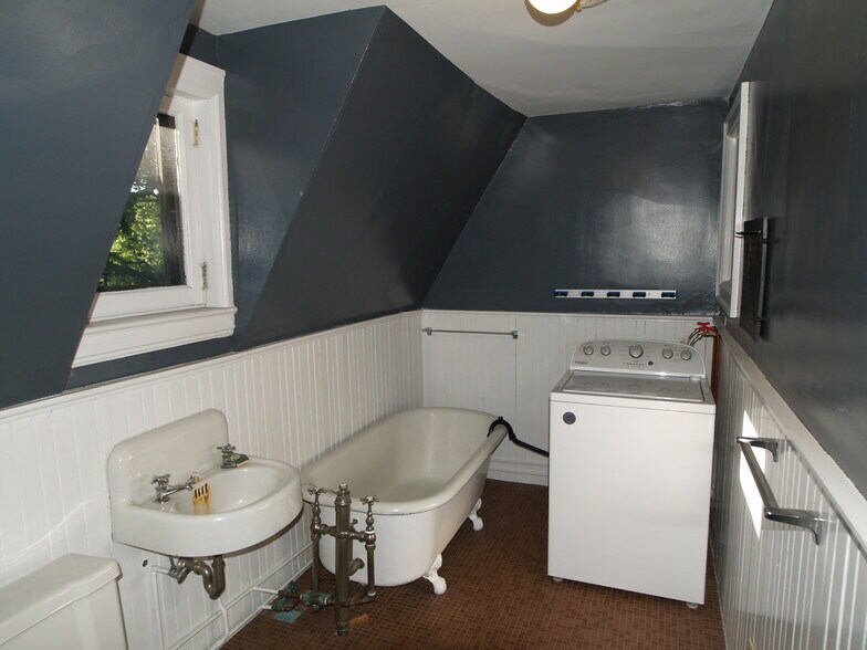 Bathroom with claw foot tub used as drain for washer - 390 Linwood Ave