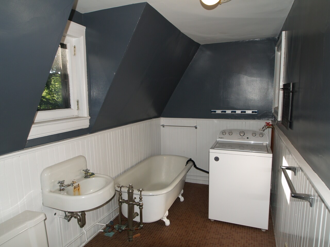 Bathroom with claw foot tub used as drain for washer - 390 Linwood Ave