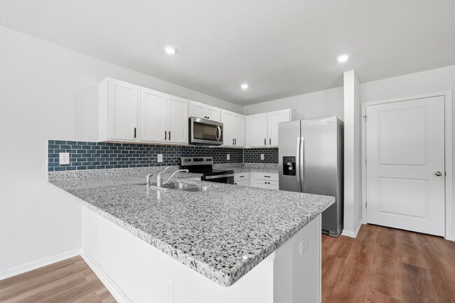Building Photo - New community! Three bedrooms, two bathrooms and ready for you to move into!