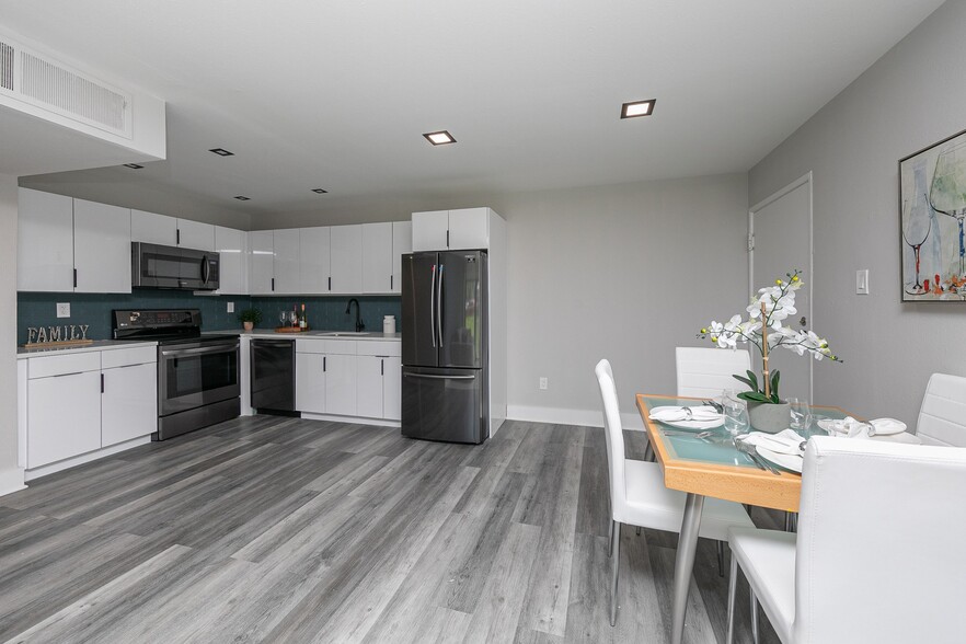 Kitchen/Dining Area Renovated - The Woods Apartments