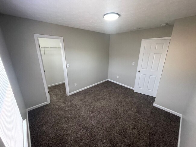 Building Photo - SUBLEASE - Three Bedroom Single Family Home with Fenced Backyard