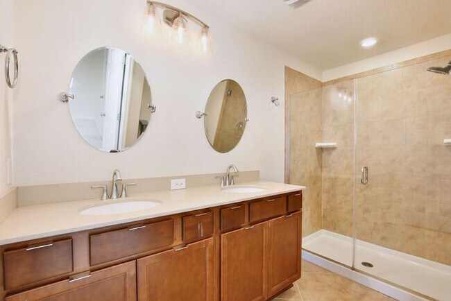 Building Photo - Immaculate Townhome · Dual En-Suite Bedrooms + Flex Loft · Cable & Internet Included · 3.5 Miles ...