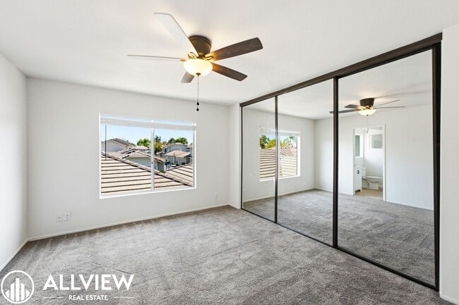 Building Photo - Fully Renovated 2 Bed Townhome with Private Patio, 2-Car Garage & Community Pool