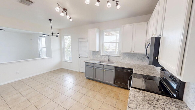 Building Photo - Expansive Living and Stylish Updates in So...