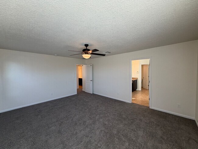 Building Photo - 4 Bedroom + Office Home Available Near Loma Colorado Blvd NE & Broadmoor Blvd NE in Rio Rancho!