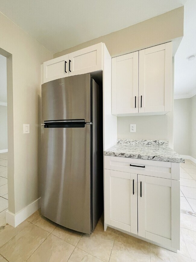 Building Photo - Updated 2-bedroom waterfront duplex with walk-in closets, enclosed Florida room, and canal views ...