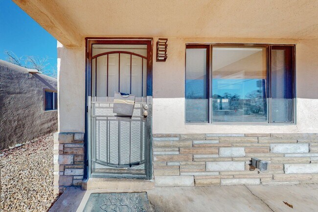 Building Photo - NE PUEBLO STYLE 3 Bedroom 2 Bath 1824/SF