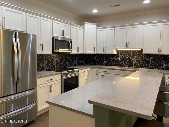Building Photo - Live in Style, Relax in Comfort, and Love ...