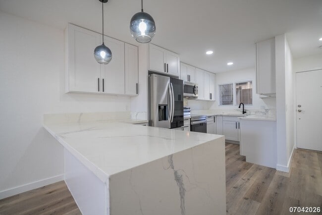 Building Photo - Rarely available ground floor townhome unit! 2 bdrm/2 bath/1 parking at Waiau Gardens Villa in Pe...