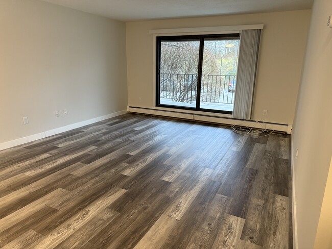 Living room with walk out balcony - 7510 Cahill Rd