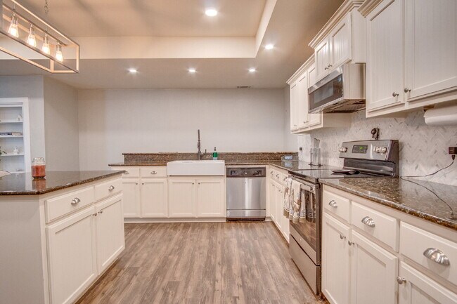 Building Photo - Milton 4BR Pool Home with Office, Vaulted Ceilings, Screened Saltwater Pool & 2-Car Garage