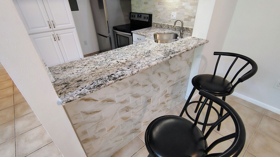 View from DR into kitchen - 1353 Pine Ridge Cir E