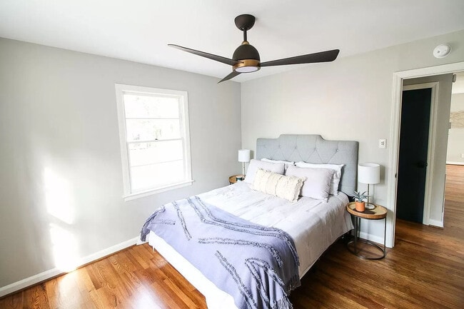 Modern ceiling fan and wood flooring in back bedroom - 905 Culpepper Ln