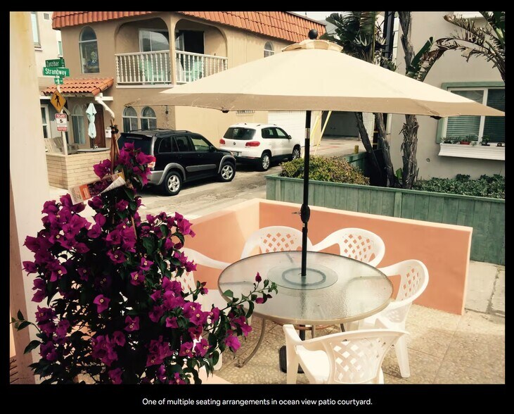 Portion of shared patio with hot tub, BBQs, tables, etc - 3990 Strandway