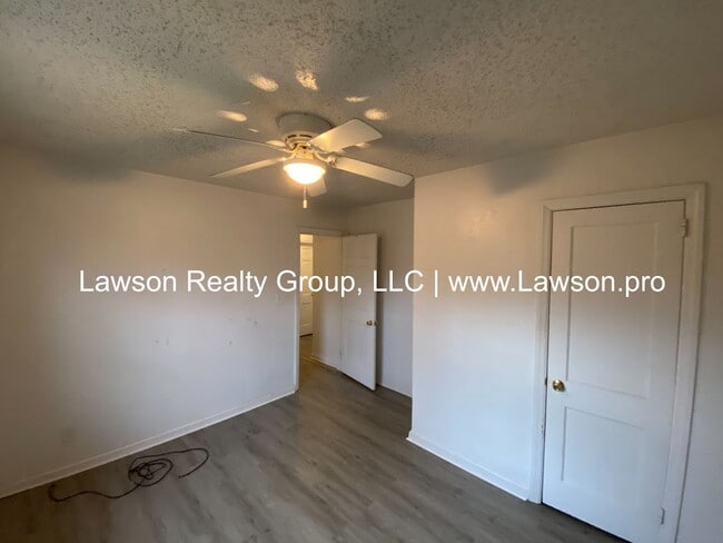 Building Photo - Well Maintained Three Bedroom with Fenced Yard and Shed