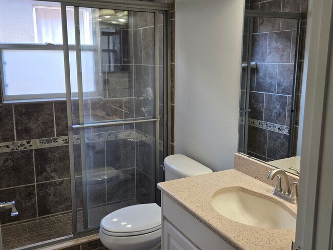 Building Photo - Freshly Painted 4BR/2BA Pool Home with Screened Pool & Spa – Move-In Ready!