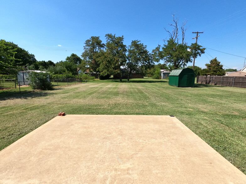 View from back porch - yard is currently fenced with large gate. - 415 W Guthrie St