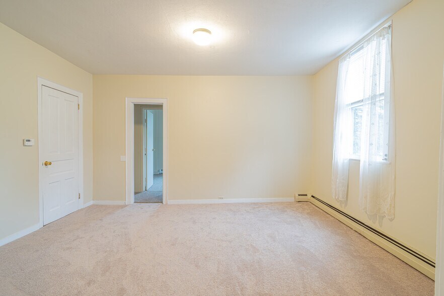 Living Room facing door to Master Bedroom - 100 N Main St
