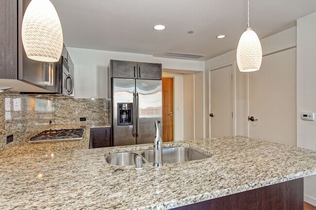 Building Photo - Modern Downtown Condo in Premier High-Rise...