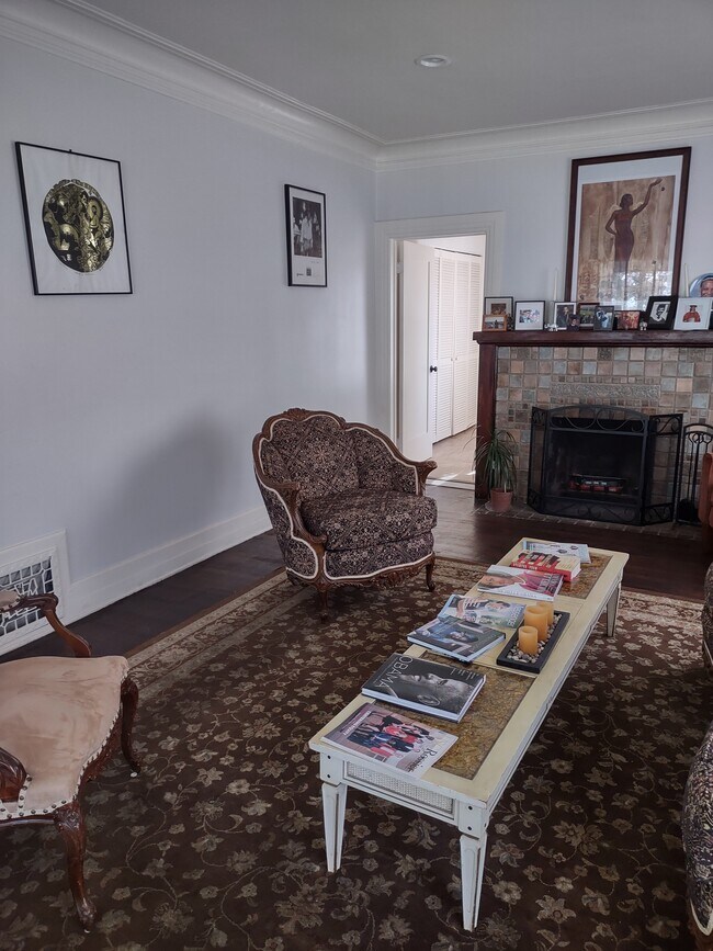 Living Room. The Furniture will be swapped out for new furniture if you want the home furnished. - 2142 S Victoria Ave