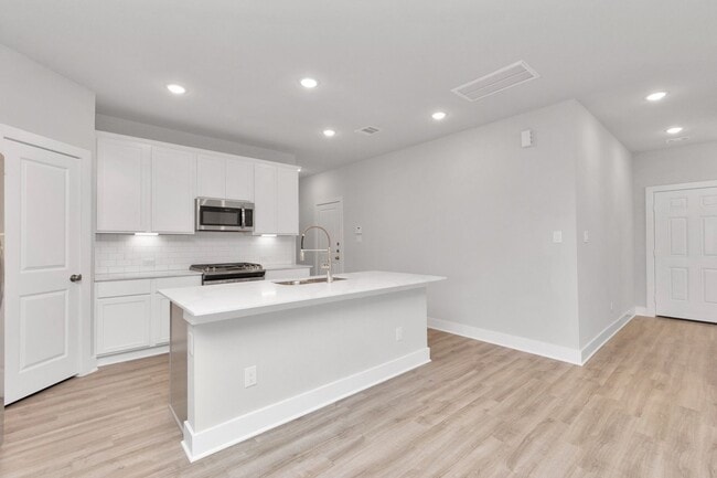 Building Photo - Welcome to the Redbud — A Fresh Take on Modern Living.