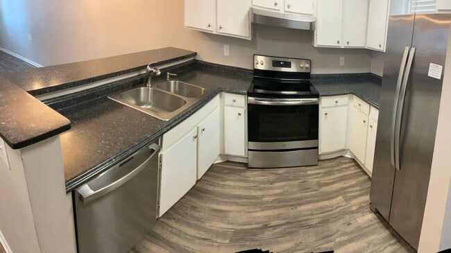 Building Photo - Just off the main road, but in walking dis...