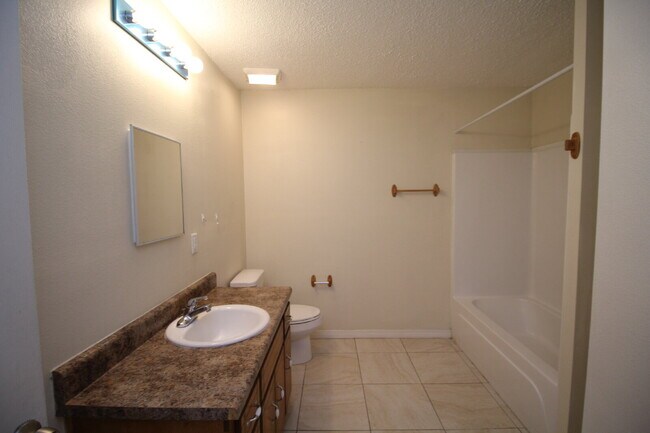 Building Photo - West Pensacola Duplex Living — 3BR Home with Open Floor Plan, Eat-In Kitchen, Covered Patio & Low...