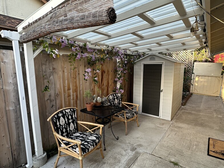 Flowers are blooming in the patio - 152 Redfield Ave