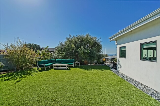 Building Photo - Beautifully Remodeled, Bright & Modern 4BR3BA Home w/ 2BR1BA Guest House On Sprawling Corner Lot ...