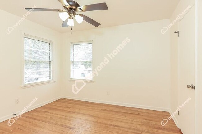 Building Photo - This Cozy 4 bedroom / 2 full bath and 2,09...
