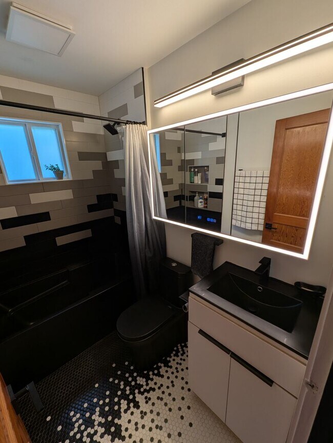 Building Photo - Charming 2BR with Walk-Out Basement, Fenced Yard & Flexible Murphy-Bed Office