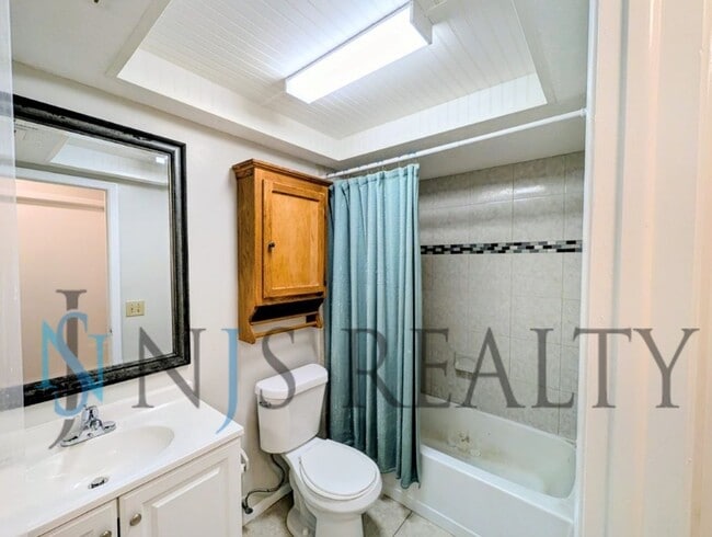 Building Photo - Beautifully updated 3/2/2 1500 Sq. Ft. with fenced yard, tile floors, HUGE living room and a corn...