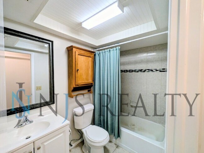 Building Photo - JUST REDUCED!!!  3/2/2 1500 Sq. Ft. with fenced yard, tile floors, HUGE living room and a corner ...