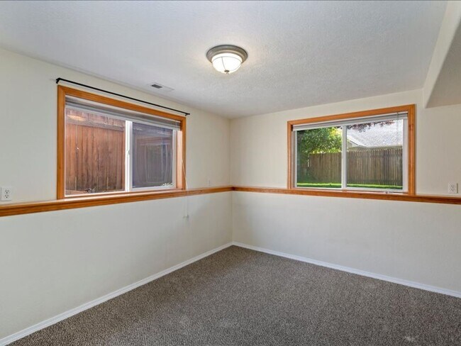 Building Photo - June Rent Free!!  Move Today!  Four Bedroom, Three Bath Home with Beautiful Backyard, Two Car Gar...