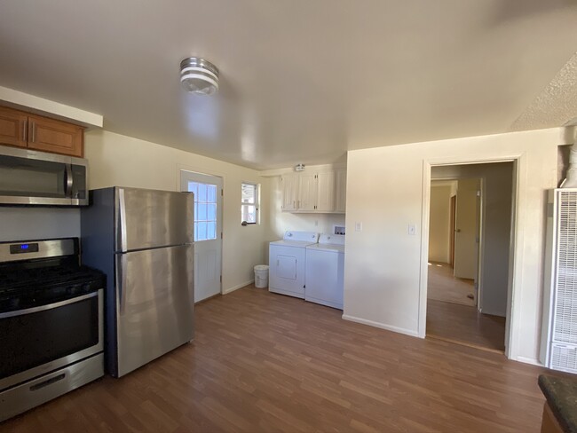 Kitchen, Laundry Area and Side Door to Carport - 1002 NM 76