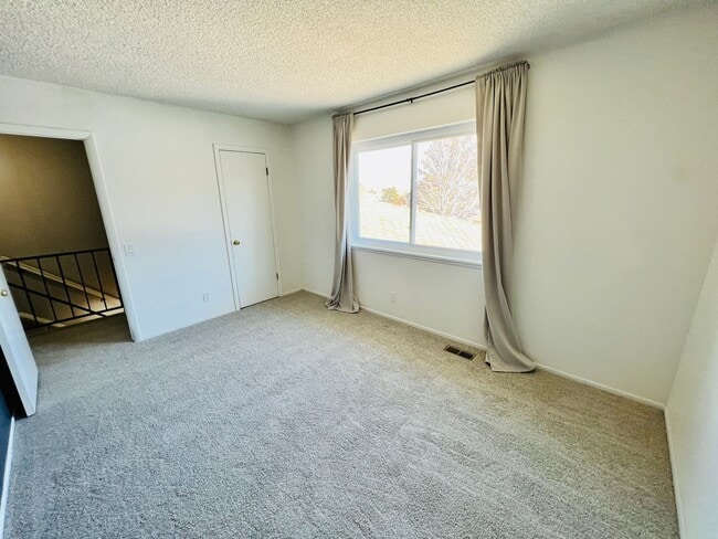 Building Photo - TWO STORY TOWNHOME, NEW FLOORING/CARPET, TWO TONE PAINT, STAINLESS APPLIANCES, WASHER/DRYER, CORN...