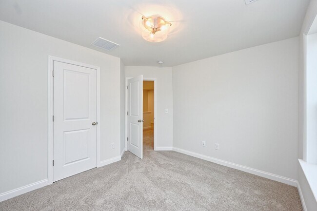 Building Photo - **BE THE LUCKY ONE TO LIVE IN THIS 2024-BUILT TOWNHOME**