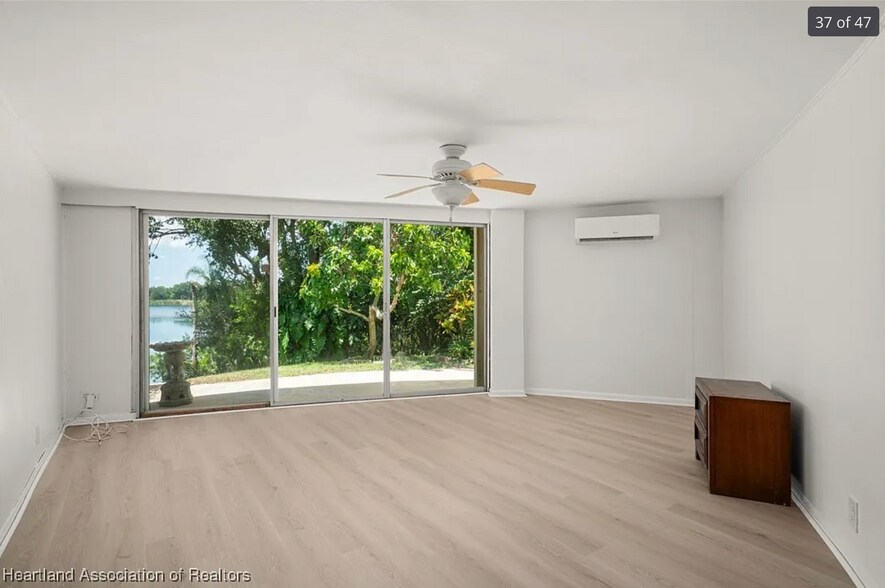 Living Room with Lake View - 202 Rachard Blvd