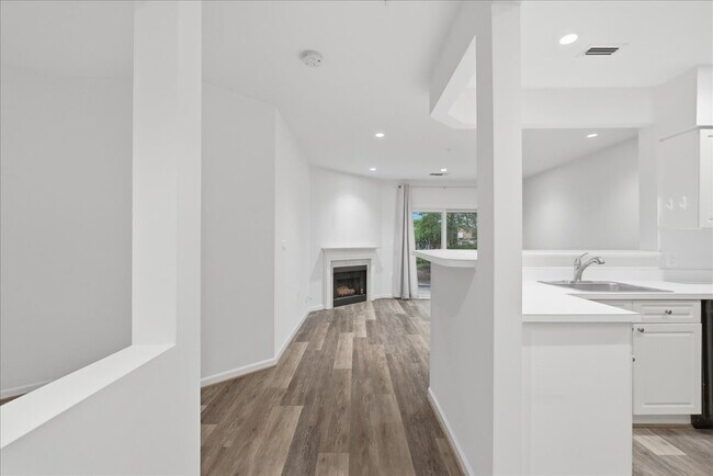 Building Photo - Commuter’s Paradise! Ground-Level 2BR Condo  Welcome home to this stunning, sun-filled 2-bedroom ...
