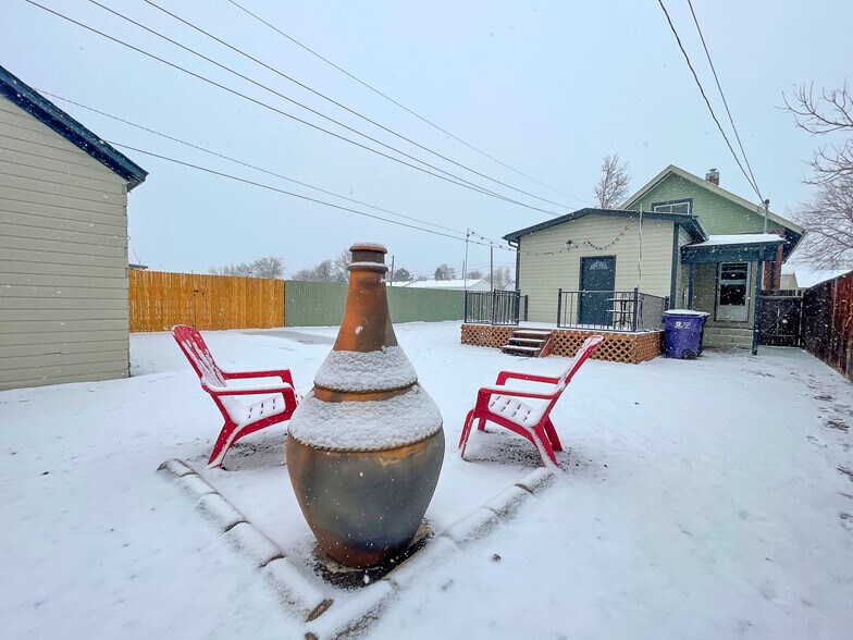 Large yard with secure, off-street parking for 2. Chiminea and adirondack chairs included. - 4404 Sherman St