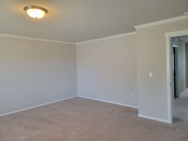 Building Photo - 3 bedroom home with 3 car garage on corner...