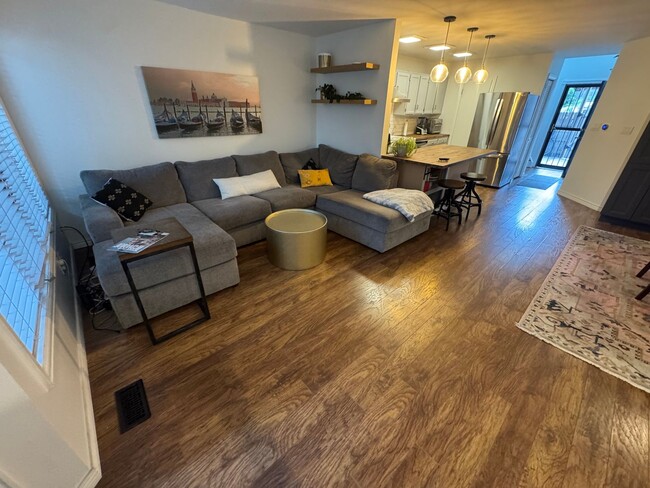 Building Photo - Bright 2BR Townhome with 3 Balconies & Private Patio